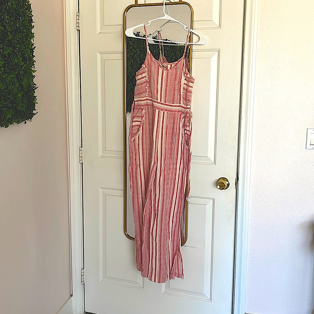 Only worn 2 times. Red and white striped jumpsuit. It has pockets.
